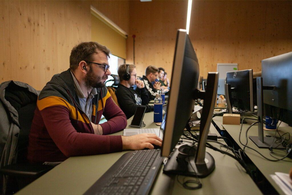Technicians at a desk with computers