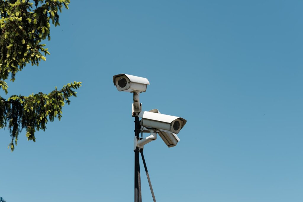 Three White Security Cameras