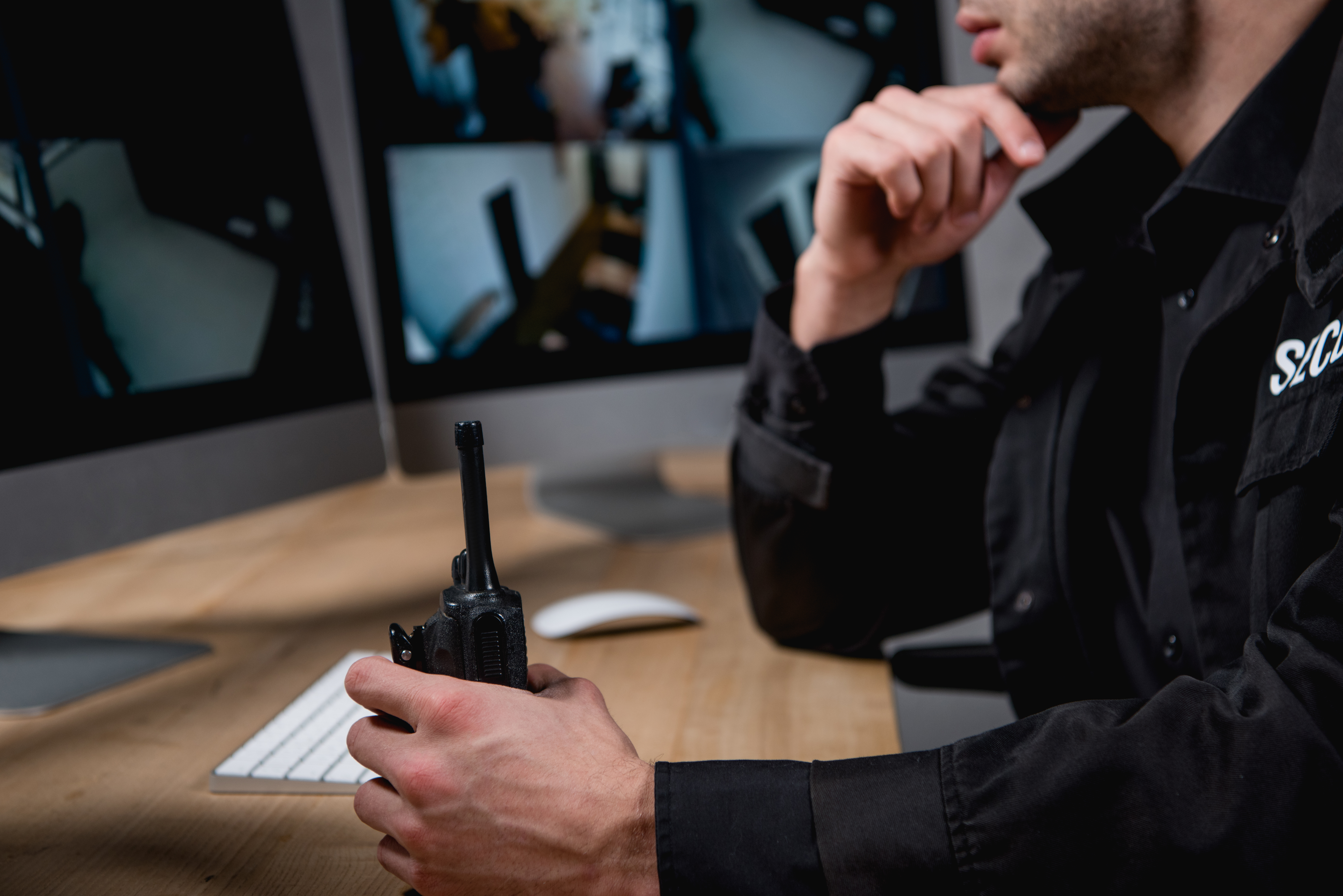 Cropped View of Guard in Uniform Holding Walkie Talkie 2