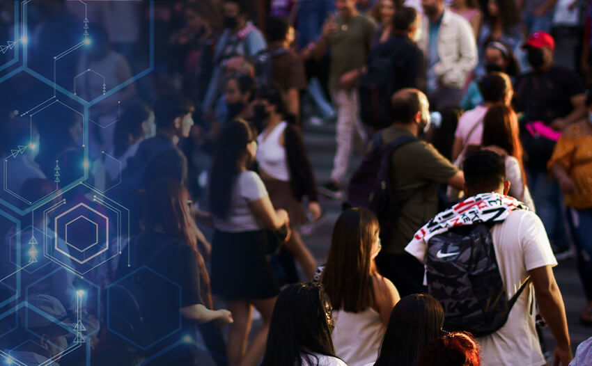 A group of people walking down a street