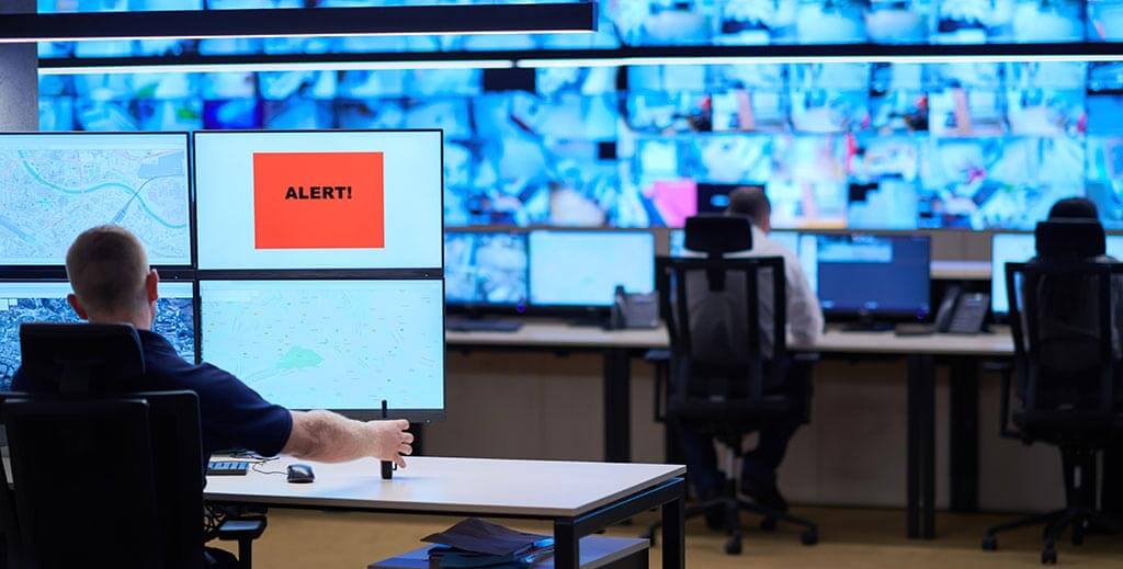 Male Security Operator Working Data System Control Room Offices